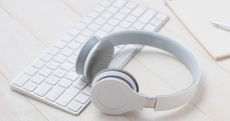 Desk with keyboard and headphones