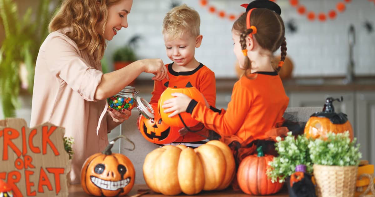 Mom and kids making Halloween crafts